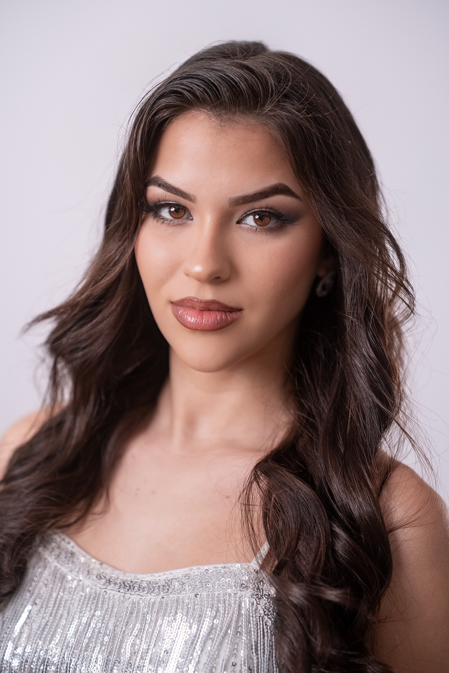Miss Nova Femina contestant Emili Leyva Rivero #139 portrait in silver evening dress